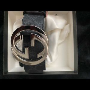 Black Gucci belt with silver double G buckle